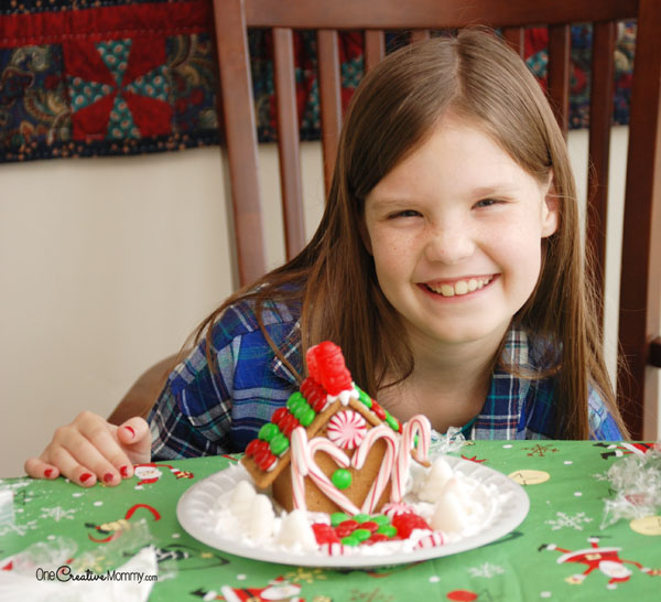 Check out these genius hacks to create a gluten free Gingerbread House in minutes! {OneCreativeMommy.com} Works with non-gluten-free houses, too.